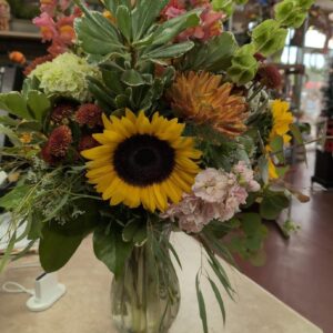 Stewart-Baxter-Funerals- Fall mix of fresh flowers in a vase