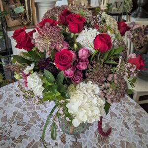Pink, burgundy and white fresh flowers in a vase