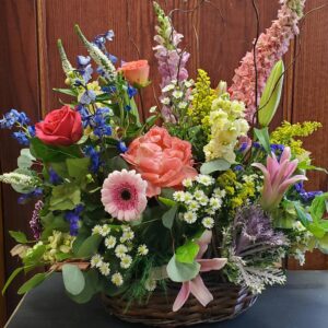 Stewart-Baxter-Funerals- Spring Summer mix of flowers in a basket