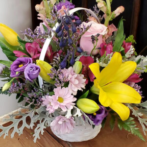 Stewart-Baxter-Funerals- Spring mix of flowers in a basket