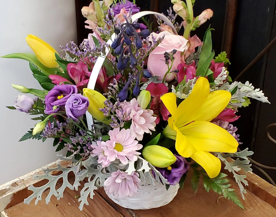 Stewart-Baxter-Funerals- Spring mix of flowers in a basket