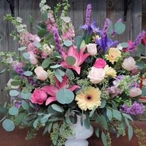 Stewart Baxter Funerals - Spring mix of flowers in classic urn.