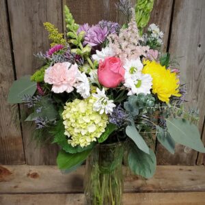 Stewart-Baxter-Funerals- Spring mix of fresh flowers in a vase