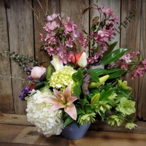 Stewart-Baxter-Funerals- Summer mix of flowers in a nice container
