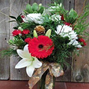 Stewart-Baxter-Funerals- Winter mix of fresh flowers in a vase
